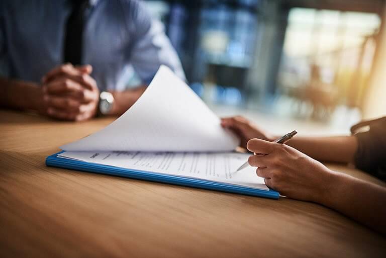 Person filling out SSDI document