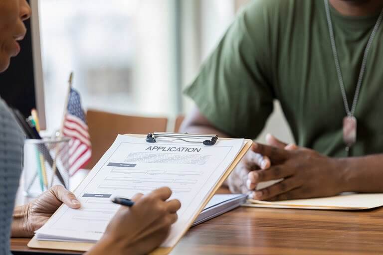 Veteran meeting with attorney to understand his VA benefits.