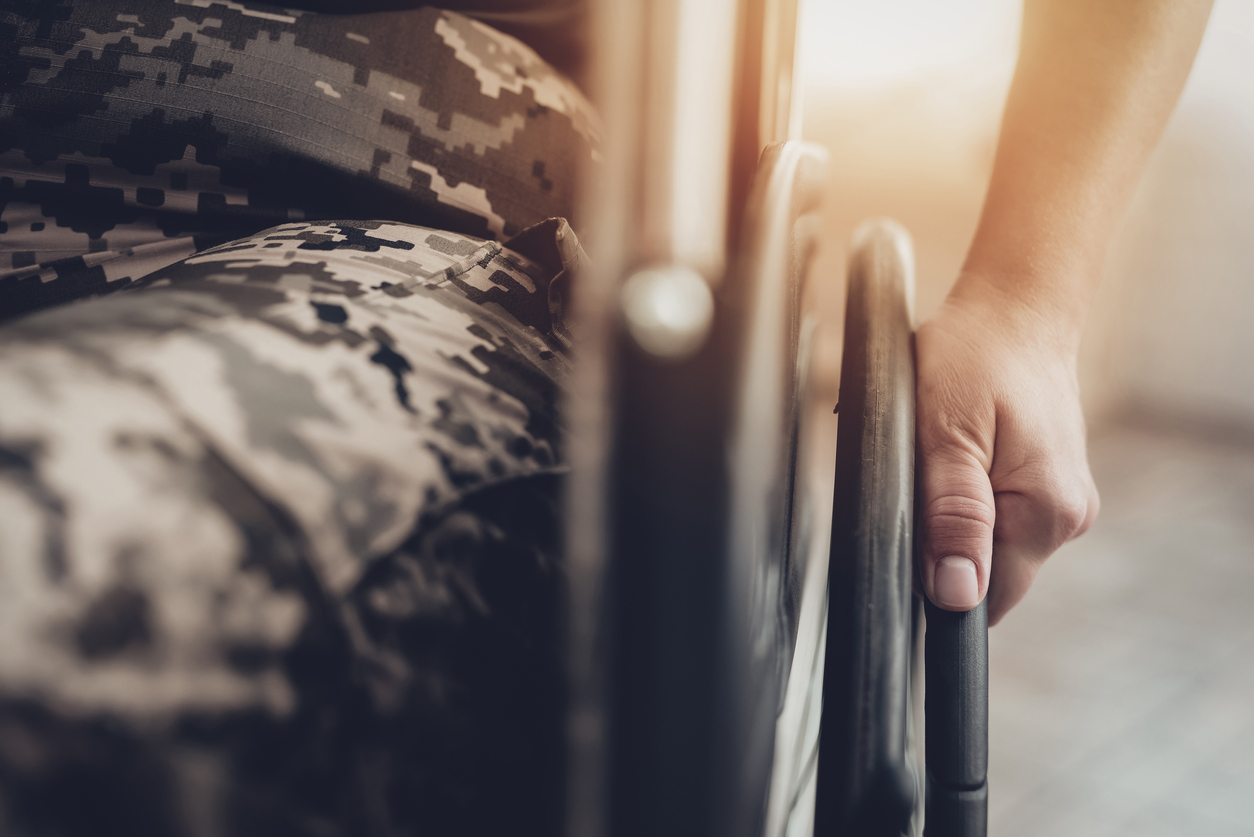 Veteran in a wheelchair receiving disability benefits.