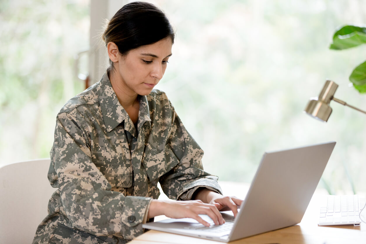 female veteran looking up VA resources