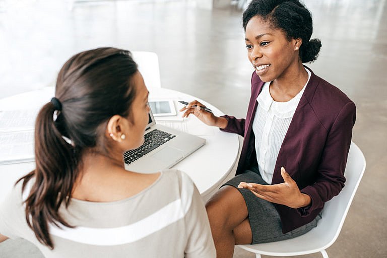 female attorney with female client