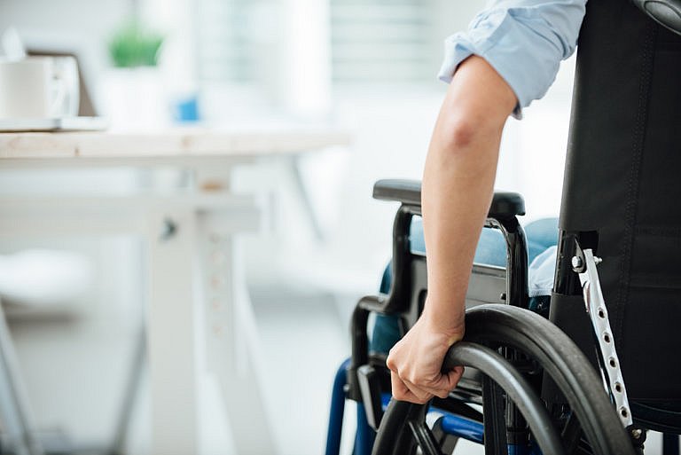 man in wheelchair at office