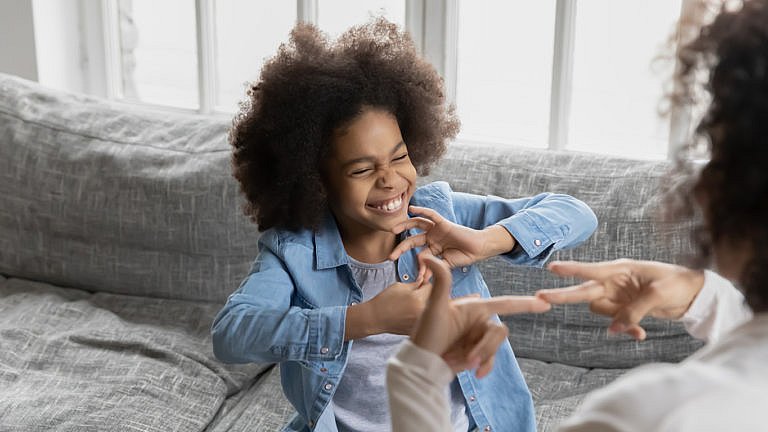 disabled child learning sign language