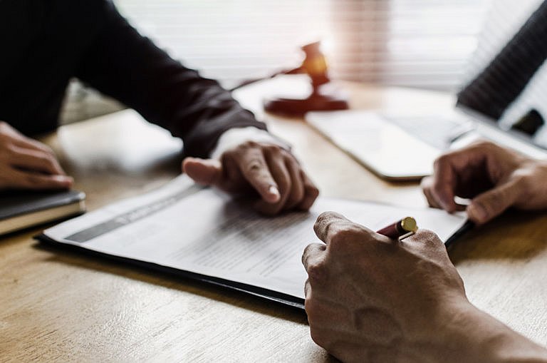 VA Disability Attorney going over medical documents with client