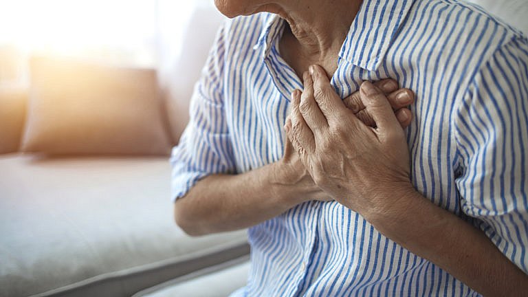 woman suffering from heart conditions