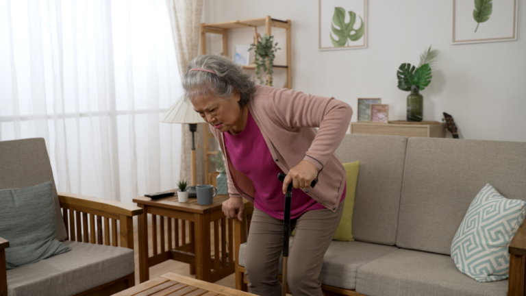 Elderly woman with back pain seeks help from DLG SSD attorneys.