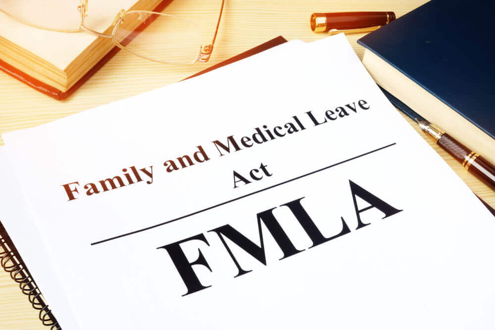 FMLA Family and Medical Leave Act on a desk.