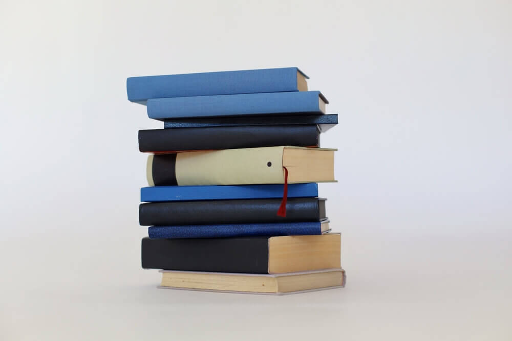 Blue and black books on white