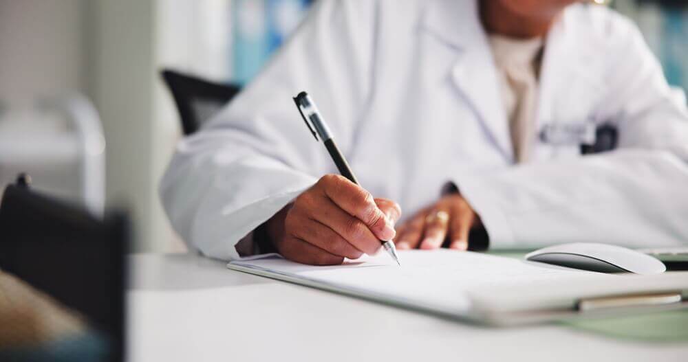 Doctor writing a detailed medical letter to support a Social Security Disability (SSD) claim