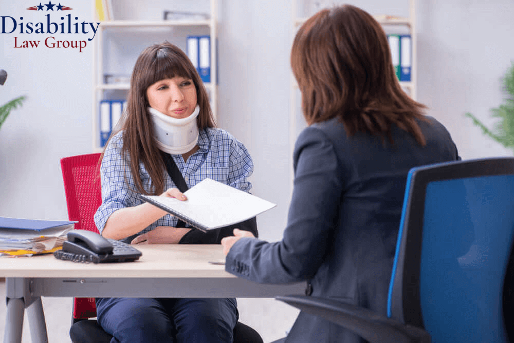 Injured woman meeting with a Macomb County Social Security Disability attorney to apply for SSD benefits.