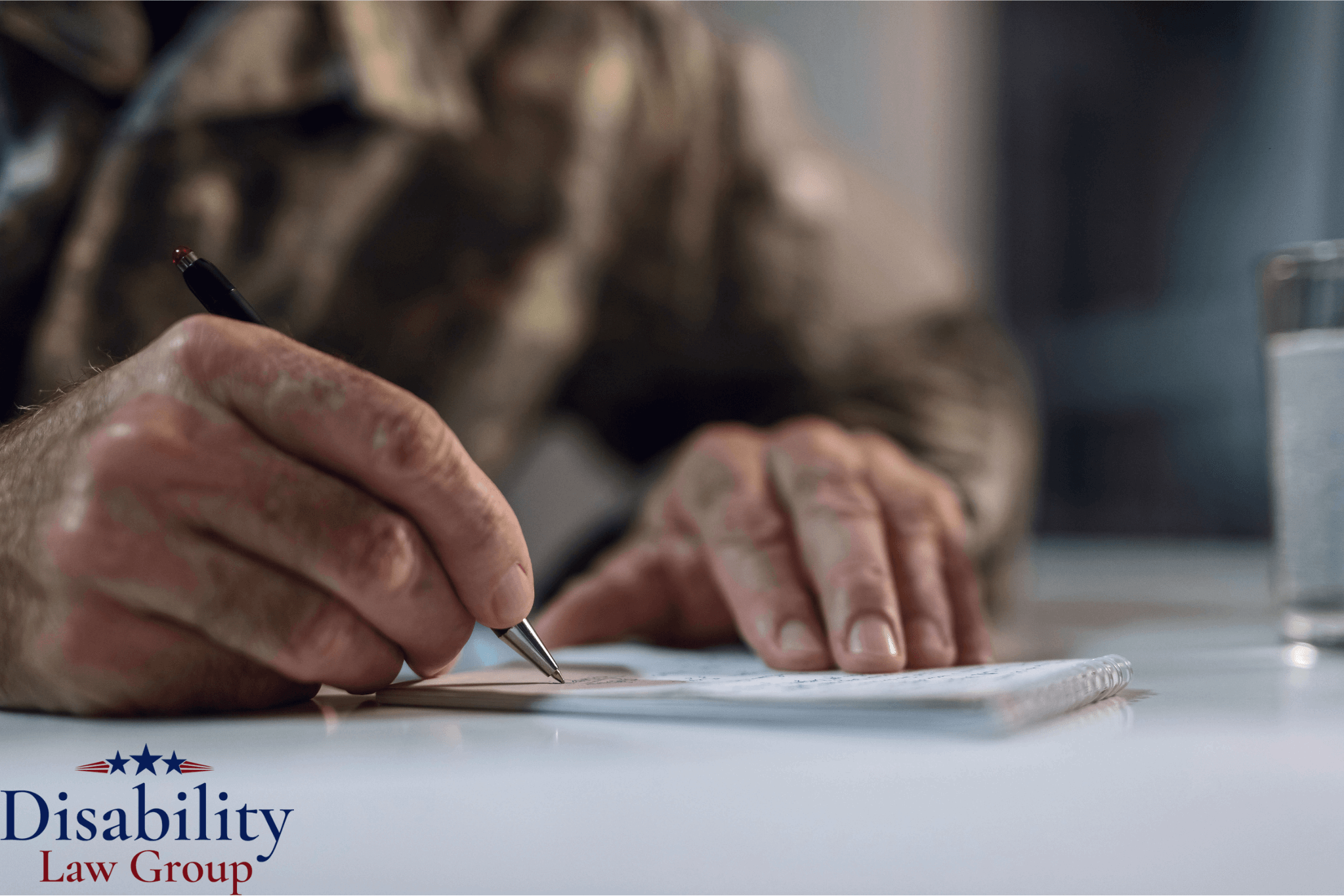 Blue Water Navy veteran completing VA disability claim paperwork with legal assistance in Michigan