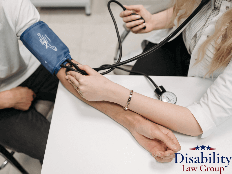 Doctor checking veteran’s blood pressure for VA disability hypertension benefits in Michigan