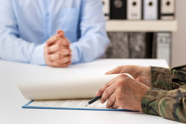 Veteran reviewing VA appeal documents with an attorney during the VA appeals process.