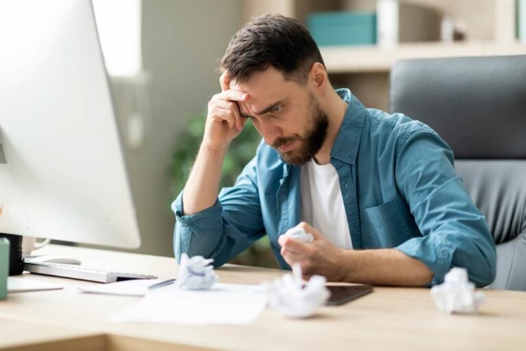 Man stressed reviewing paperwork for SSDI mental health disability claim